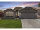 Charming single-story home with desert landscaping, tile roof, and welcoming curb appeal at 9853 W Tonopah Dr, Peoria, AZ 85382