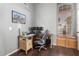 Comfortable home office with built-in storage, ample lighting, and a modern computer setup at 9853 W Tonopah Dr, Peoria, AZ 85382