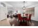 Open-concept layout showcasing a dining area and living room with hardwood floors at 9853 W Tonopah Dr, Peoria, AZ 85382