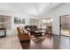 Bright living room featuring modern decor, wood floors, and comfortable seating at 9853 W Tonopah Dr, Peoria, AZ 85382