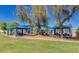 Scenic park featuring mature trees, picnic shelters, and a playground for Gathering fun at 9853 W Tonopah Dr, Peoria, AZ 85382