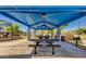 Covered picnic area with multiple tables and benches, perfect for outdoor gatherings at 9853 W Tonopah Dr, Peoria, AZ 85382