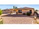 Cozy backyard patio with covered seating area and low-maintenance desert landscaping at 10510 W Louise Dr, Peoria, AZ 85383