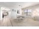 Bright dining room with chandelier, large window, and access to the kitchen at 10510 W Louise Dr, Peoria, AZ 85383