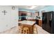 Well-lit kitchen with modern appliances, an island, and wooden cabinetry at 10510 W Louise Dr, Peoria, AZ 85383