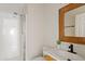 Full bathroom with tile shower, framed mirror, and stylish modern fixtures at 11405 E Rafael Ave, Mesa, AZ 85212