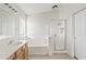 Bathroom featuring a large bathtub, shower, window with blinds, and modern sink at 11405 E Rafael Ave, Mesa, AZ 85212