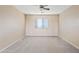 Spacious bedroom with carpet flooring, ceiling fan, and a window for natural light at 11405 E Rafael Ave, Mesa, AZ 85212