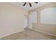 Neutral bedroom with carpeted floors, arched window and doorway, and ample natural light at 11405 E Rafael Ave, Mesa, AZ 85212