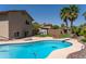 Home exterior showcasing the pool, landscaping, and backyard at 1213 N Raven --, Mesa, AZ 85207