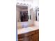 Well-lit bathroom featuring a vanity with a mirror, ample counter space, and a clean design at 1213 N Raven --, Mesa, AZ 85207