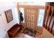 Inviting entryway featuring a bench, coat rack, decorative mirror, and bright natural lighting at 1213 N Raven --, Mesa, AZ 85207