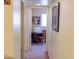 Hallway leading to a sewing room featuring neutral walls and carpeted floor at 1213 N Raven --, Mesa, AZ 85207