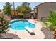 Sparkling pool with diving board, deck and lovely flowers make this backyard great for entertaining friends and Gathering at 1213 N Raven --, Mesa, AZ 85207