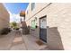 Apartment building exterior showing the stairs to unit 1257 plus a security door and a welcome mat at 1257 N 47Th Pl, Phoenix, AZ 85008