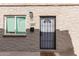 Exterior view of front entrance with a security door, window, and decorative welcome mat at 1257 N 47Th Pl, Phoenix, AZ 85008