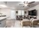 Inviting living room with a ceiling fan, wood plank floors, and comfortable seating at 1257 N 47Th Pl, Phoenix, AZ 85008