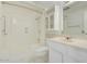 Bright bathroom featuring a shower-tub combo and a marble vanity with plenty of storage at 12887 N 99Th Dr, Sun City, AZ 85351