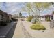 Well-maintained community grounds with mature trees, walkways, and desert landscaping at 12887 N 99Th Dr, Sun City, AZ 85351