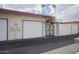 Home featuring a two-car garage with a gated entrance to the home's front entryway at 12887 N 99Th Dr, Sun City, AZ 85351