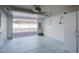 Clean two-car garage providing ample storage and workspace with an automatic door at 12887 N 99Th Dr, Sun City, AZ 85351