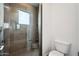 Stylish bathroom showcasing a modern glass-enclosed shower with tiled walls at 13116 E Desert Holly Dr, Scottsdale, AZ 85255