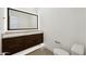 Modern bathroom featuring a sleek vanity, large mirror, and tiled floors at 13116 E Desert Holly Dr, Scottsdale, AZ 85255