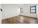 Bright bedroom with hardwood floors and natural light at 13116 E Desert Holly Dr, Scottsdale, AZ 85255