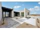 Striking home with a modern design, desert landscaping, and sleek architectural details that create an inviting entrance at 13116 E Desert Holly Dr, Scottsdale, AZ 85255