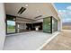 Seamless transition from the covered patio to the interior, showcasing an open-concept design and expansive backyard at 13116 E Desert Holly Dr, Scottsdale, AZ 85255