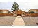 Inviting community entrance featuring a decorative brick wall and bench seating for residents at 13251 W Aleppo Dr, Sun City West, AZ 85375