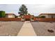 Welcoming community entrance featuring a decorative brick wall and a well-maintained walkway at 13251 W Aleppo Dr, Sun City West, AZ 85375