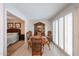 Formal dining room featuring shuttered windows, wood table with seating for six with view to the bedroom at 13251 W Aleppo Dr, Sun City West, AZ 85375