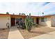 Home exterior featuring desert landscaping, mature trees and sidewalk at 13251 W Aleppo Dr, Sun City West, AZ 85375