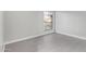 An empty bedroom with light gray walls, tile floor, and a window at 1351 N Pleasant Dr # 2030, Chandler, AZ 85225