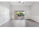 Bright living room with sliding glass doors to the balcony and modern gray-scale finishes at 1351 N Pleasant Dr # 2030, Chandler, AZ 85225