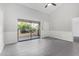 Bright living room featuring a sliding glass door to balcony and modern gray-scale finishes at 1351 N Pleasant Dr # 2030, Chandler, AZ 85225