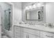 Bathroom featuring a marble countertop, white cabinets, and modern fixtures at 14442 N Prickly Pear Ct, Fountain Hills, AZ 85268