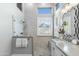 Bright bathroom featuring a glass enclosed shower, marble countertops, and charming fixtures at 14442 N Prickly Pear Ct, Fountain Hills, AZ 85268