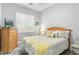 Cozy bedroom with a wood frame bed, gray walls, and wood-look floors at 14442 N Prickly Pear Ct, Fountain Hills, AZ 85268