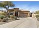 Inviting single-story home with manicured desert landscaping, a tile roof, and a spacious driveway at 14442 N Prickly Pear Ct, Fountain Hills, AZ 85268