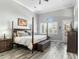 Serene bedroom with a four-poster bed, light-filled windows, and neutral decor, creating a relaxing atmosphere at 14442 N Prickly Pear Ct, Fountain Hills, AZ 85268