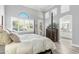 Spacious bedroom featuring a four-poster bed, arch window and ensuite bathroom, creating a luxurious space at 14442 N Prickly Pear Ct, Fountain Hills, AZ 85268