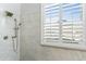 Close up of a shower featuring white marble tile and modern fixtures at 14442 N Prickly Pear Ct, Fountain Hills, AZ 85268