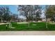 An outside community basketball court with lush greenery and mature trees at 14870 W Encanto Blvd # 2069, Goodyear, AZ 85395