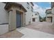 Inviting front entrance with a blue door, clean landscaping, and convenient parking spots at 14870 W Encanto Blvd # 2069, Goodyear, AZ 85395