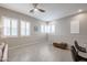 Bright living room with neutral walls, tile floors and comfortable leather furniture at 14870 W Encanto Blvd # 2069, Goodyear, AZ 85395