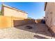 Gravel backyard with block fence and an in-ground fire pit at 14970 N 172Nd Dr, Surprise, AZ 85388