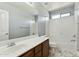 Bright bathroom features a vanity sink with a bathtub at 14970 N 172Nd Dr, Surprise, AZ 85388