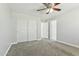 Bright bedroom with a ceiling fan, closet and neutral tones at 14970 N 172Nd Dr, Surprise, AZ 85388